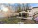 Backyard featuring patio, gazebo and new fence at 121 Hamilton St, Henderson, NC 27536