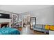 Bedroom with hard wood floors, seating, and fireplace at 121 Hamilton St, Henderson, NC 27536