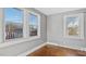 Bright bedroom featuring white trim, gray walls, and natural light from the window at 121 Hamilton St, Henderson, NC 27536