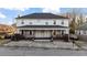 Two-story home featuring a covered front porch and mature landscaping at 121 Hamilton St, Henderson, NC 27536