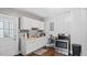 Kitchen with white cabinets and stainless steel oven at 121 Hamilton St, Henderson, NC 27536