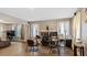 Open-concept living room featuring hardwood floors, large windows, and a decorative fireplace at 121 Hamilton St, Henderson, NC 27536
