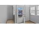 Bright mudroom featuring tile floors, a window and natural light at 121 Hamilton St, Henderson, NC 27536