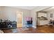 Room with a glimpse of the kitchen and the bathroom at 121 Hamilton St, Henderson, NC 27536