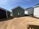 Spacious backyard featuring dirt landscaping, with neighboring houses displaying clean designs and exteriors at 1905 Plott Balsam Dr, Wendell, NC 27591