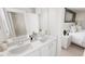Bright, stylish bathroom with double sinks, sleek countertops, and a modern design aesthetic at 1905 Plott Balsam Dr, Wendell, NC 27591