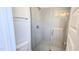 Modern bathroom featuring a glass-enclosed shower with gray tiling and updated fixtures at 1905 Plott Balsam Dr, Wendell, NC 27591