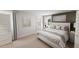 Stylishly staged bedroom with a plush bed, modern decor, and ample natural light for a relaxing ambiance at 1905 Plott Balsam Dr, Wendell, NC 27591