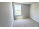 Bright bedroom with neutral carpet and a window that provides natural light and outside views at 1905 Plott Balsam Dr, Wendell, NC 27591