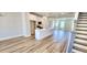 Open-concept living space with a modern kitchen featuring a center island and stainless steel appliances at 1905 Plott Balsam Dr, Wendell, NC 27591
