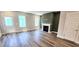 Bright living room featuring a fireplace and natural light from the windows at 1905 Plott Balsam Dr, Wendell, NC 27591