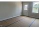 Bright, unfinished space showcasing a door to the backyard and a window with ample natural light at 1905 Plott Balsam Dr, Wendell, NC 27591