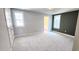 Spacious main bedroom with neutral walls, plush carpeting, and natural light at 1905 Plott Balsam Dr, Wendell, NC 27591