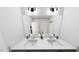 Clean, modern bathroom with double sinks, white countertops, and a large mirror at 1907 Plott Balsam Dr, Wendell, NC 27591