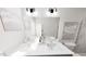 Well-lit bathroom featuring double vanity with modern faucets and elegant marble shower at 1907 Plott Balsam Dr, Wendell, NC 27591