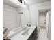 Bathroom boasts double sinks with dark cabinets, marble flooring, and a tub/shower combo at 1907 Plott Balsam Dr, Wendell, NC 27591
