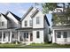 Charming two-story home with white siding, a red door, and a cozy front porch at 1907 Plott Balsam Dr, Wendell, NC 27591