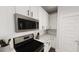 Sleek kitchen featuring stainless steel appliances, white cabinets and modern countertop at 1907 Plott Balsam Dr, Wendell, NC 27591