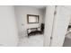 Welcoming mudroom with bench seating, stylish mirror and neutral color palette at 1907 Plott Balsam Dr, Wendell, NC 27591