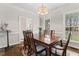 Traditional dining room featuring a wood table, chandelier lighting, and large windows with lots of natural light at 2015 Pratt Cir, Franklinton, NC 27525