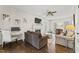 Cozy living room features a fireplace, ceiling fan, and hardwood flooring at 2015 Pratt Cir, Franklinton, NC 27525