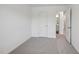 Comfortable bedroom with neutral walls and adjacent hallway at 2058 Glen Crossing Dr, Durham, NC 27704