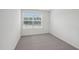 Minimalist bedroom with neutral carpet and a bright window at 2058 Glen Crossing Dr, Durham, NC 27704