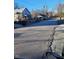 Shot of the street and homes with multiple utilities poles and a bin at 206 S Goley St, Durham, NC 27701