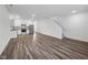 Bright living area with an open floorplan, wood flooring, and stairs to upper level at 2060 Glen Crossing Dr, Durham, NC 27704