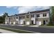 Charming townhome exterior showcasing a blend of brick and siding accents at 2115 Trailside Dr, Durham, NC 27704