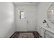 Bright foyer with decorative rug, console table, and contemporary decor at 2115 Trailside Dr, Durham, NC 27704
