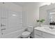 Bright bathroom featuring a tub with shower, toilet, vanity with sink, and modern fixtures at 2117 Trailside Dr, Durham, NC 27704