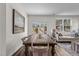 Dining area with a rustic wooden table, seating for six, and a view to the backyard at 2117 Trailside Dr, Durham, NC 27704