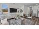 Bright living space featuring wood floors, comfortable seating, an entertainment center and plenty of natural light at 2117 Trailside Dr, Durham, NC 27704