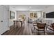 Open-concept living and dining area with hardwood floors and neutral paint, perfect for entertaining at 2117 Trailside Dr, Durham, NC 27704