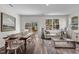 Open-concept living and dining area with hardwood floors and neutral paint, perfect for entertaining at 2117 Trailside Dr, Durham, NC 27704
