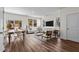Bright living room with large windows, contemporary furnishings, and wood-look flooring at 2117 Trailside Dr, Durham, NC 27704