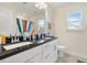 Bathroom with double sinks, granite countertops, and ample cabinet space, perfect for a Gathering at 220 Green Haven Blvd, Youngsville, NC 27596