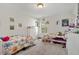 Bright bedroom featuring two twin beds and a window, perfect for children or guests at 220 Green Haven Blvd, Youngsville, NC 27596