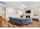 Spacious living room with fireplace and view to the kitchen at 220 Green Haven Blvd, Youngsville, NC 27596