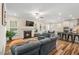Cozy living room featuring a fireplace, comfortable seating, and a view into the modern kitchen at 220 Green Haven Blvd, Youngsville, NC 27596
