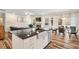 Open concept living space connecting the kitchen, dining, and living areas for a seamless flow at 220 Green Haven Blvd, Youngsville, NC 27596