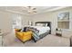 Main bedroom features a tray ceiling and leads into the main bath at 220 Green Haven Blvd, Youngsville, NC 27596