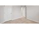 Bright bedroom featuring neutral walls and carpet, complemented by white doors and trim at 240 Amber Acorn Ave, Raleigh, NC 27603