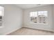 Bright, carpeted bedroom with neutral decor and double hung windows at 240 Amber Acorn Ave, Raleigh, NC 27603