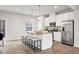 Bright kitchen with stainless steel appliances, granite countertops, and an island with seating at 240 Amber Acorn Ave, Raleigh, NC 27603