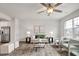 Bright living room with neutral decor, modern furnishings, and a stylish ceiling fan at 240 Amber Acorn Ave, Raleigh, NC 27603