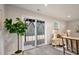 Bright living room with sliding glass door and view to the backyard at 240 Amber Acorn Ave, Raleigh, NC 27603