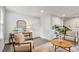 Comfortable living room with neutral decor, accent chair, and wood-look floors at 240 Amber Acorn Ave, Raleigh, NC 27603