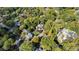 Scenic aerial view of a home surrounded by lush trees, highlighting the neighborhood and landscaped yard at 2658 Davis St, Raleigh, NC 27608